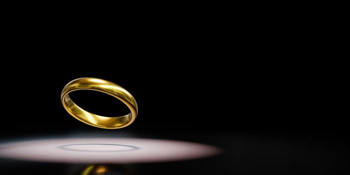 One Single Golden Ring Spotlighted on Black Background with Copy Space 3D Illustration