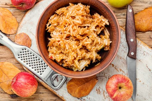 Grated ripe autumn apples fruit salad.Autumn fruit dessert