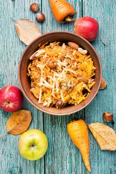 Seasonal autumn salad, grated apples with carrots.