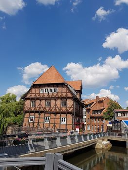 Half-timbered red brick houses near the river on the old harbor Lueneburg, Germany