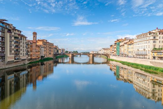 View of medieval stone bridge over Arno river in Florence, Tuscany, Italy. Florence cityscape. Florence architecture and landmark.