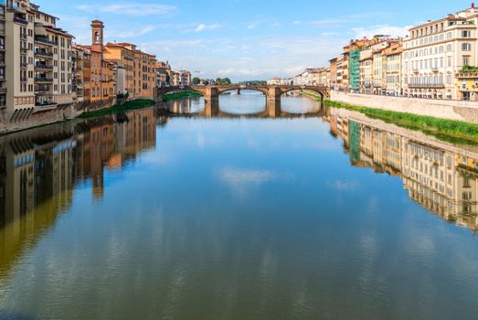View of medieval stone bridge over Arno river in Florence, Tuscany, Italy. Florence cityscape. Florence architecture and landmark.