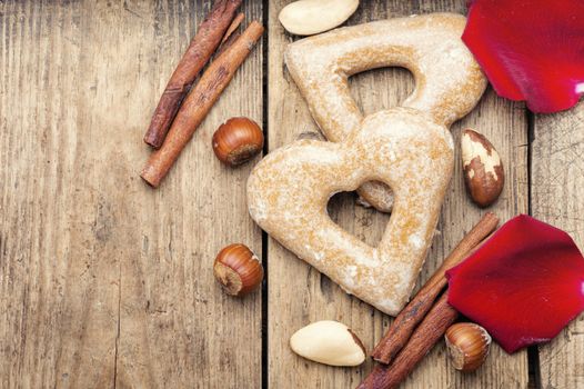 Heart shaped cookies for Valentine day on wooden background.Space for text