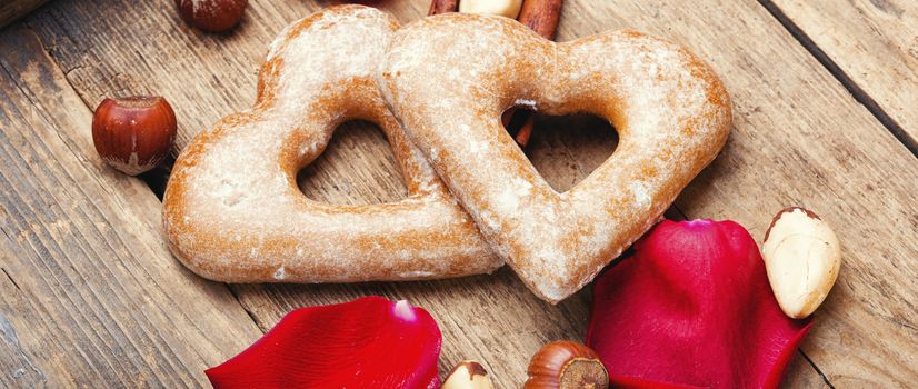 Heart shaped cookies for Valentine day on wooden background