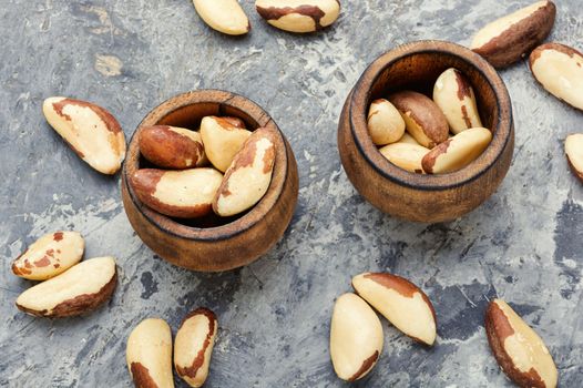 Wooden retro mortar filled with Brazil nut