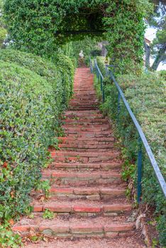 Santa Clotilde gardens in summer. Beautiful landscape with decorative covered with ivy step ladder in the garden. Costa Brava, Lloret de Mar, Spain.