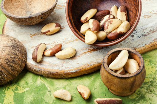 Bertholletia.Peeled brazil nut in wooden mortar.Healthy food