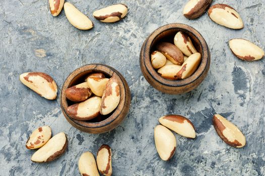 Wooden retro mortar filled with Brazil nut