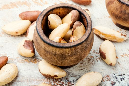 Wooden retro mortar filled with Brazil nut