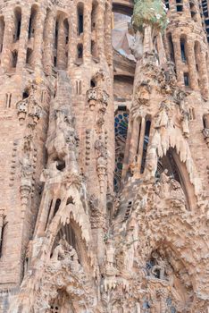BARCELONA, SPAIN - OCTOBER 08, 2018: Sagrada Familia, detail of the facade. The cathedral designed by Antoni Gaudi is being built since 1882 and is not finished yet. UNESCO World Heritage Site