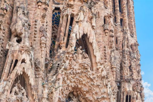 BARCELONA, SPAIN - OCTOBER 08, 2018: Sagrada Familia, detail of the facade. The cathedral designed by Antoni Gaudi is being built since 1882 and is not finished yet. UNESCO World Heritage Site