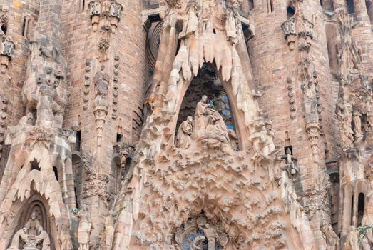 BARCELONA, SPAIN - OCTOBER 08, 2018: Sagrada Familia, detail of the facade. The cathedral designed by Antoni Gaudi is being built since 1882 and is not finished yet. UNESCO World Heritage Site