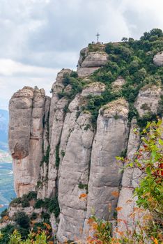 Montserrat is a mountain near Barcelona, in Catalonia. It is the site of a Benedictine abbey, Santa Maria de Montserrat, which hosts the Virgin of Montserrat sanctuary