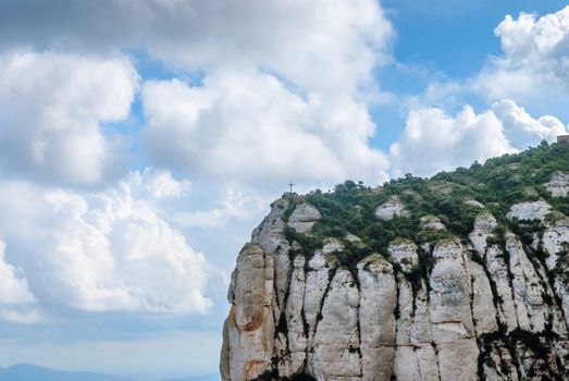 Montserrat is a mountain near Barcelona, in Catalonia. It is the site of a Benedictine abbey, Santa Maria de Montserrat, which hosts the Virgin of Montserrat sanctuary