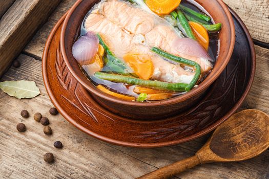 Appetizing dietary boiled salmon or trout.Fish broth