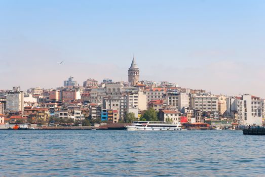 Istanbul city skyline in Turkey, Beyoglu district old houses with Galata tower on top, view from the Golden Horn.