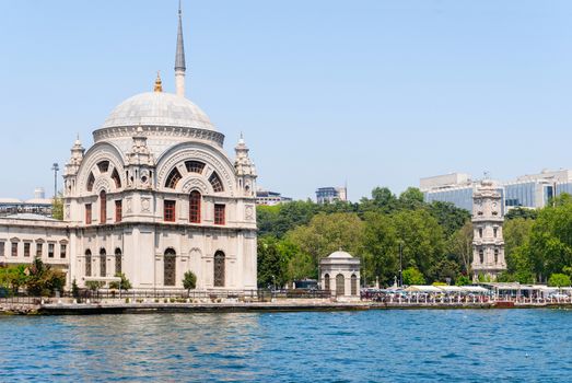 Dolmabahce Mosque. Famous historical structure of Istanbul and a view from the sea. Dolmabahce district. Istanbul. Turkey.