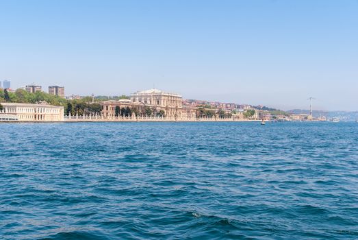 Dolmabahce Palace view from Bosphorus strait in Istanbul Turkey from ferry on a sunny summer day