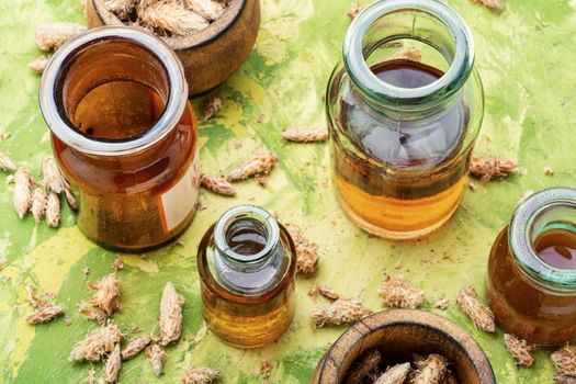 Healing tincture from pine kidneys.Medicinal tincture for colds.Herbal medicine