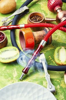 Arabic smoking hookah with taste of kiwi.Fruit shisha tobacco. Tobacco with taste of kiwi.Oriental tobacco hooka