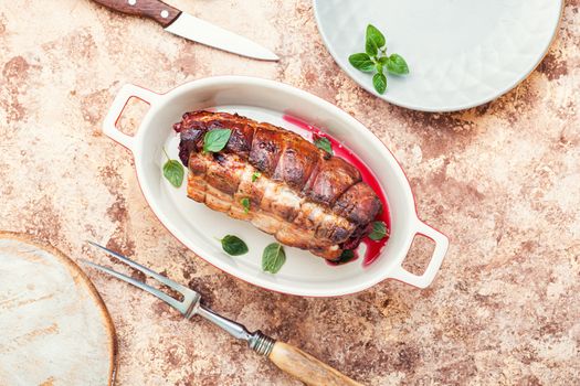 Baked pork meat stuffed with cherries.Baked pork.