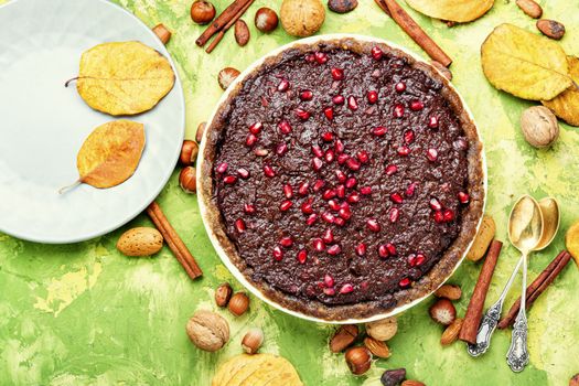 Delicious chocolate cake with pomegranate and nut.Chocolate brownie cake