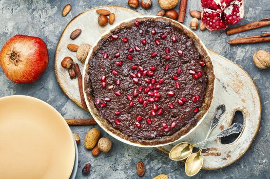 Delicious chocolate cake with pomegranate and nut.Chocolate cake