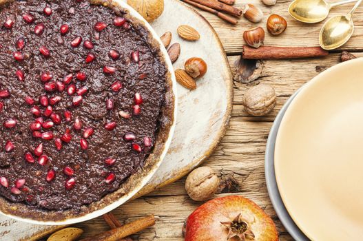 Delicious chocolate cake with nut.Homemade chocolate cake on wooden background