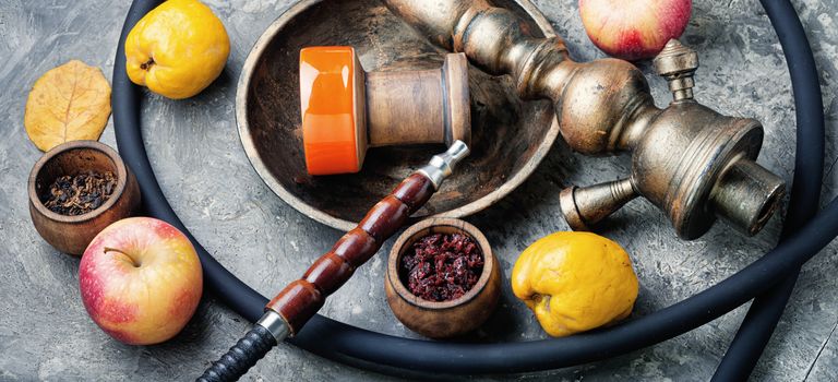 Preparation of a smoking shisha.Oriental hookah with a fruit aroma.Hookah on an quince
