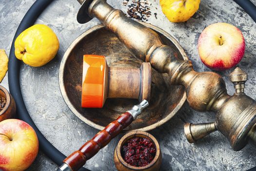 Oriental smoking shisha.Hookah bowl and tobacco.Details of Turkish nargile.Kalian tobacco with apple aroma and quince.