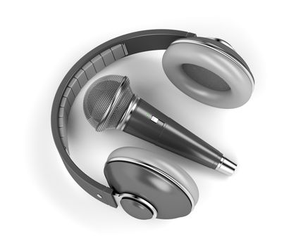 Black wireless microphone and headphones on white background