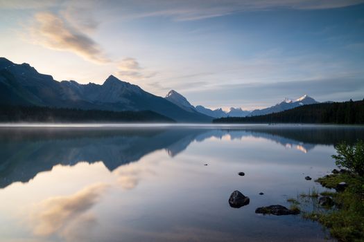 Long exposure panoramic image of the Maligne Lake close to Jasper with early morning mood, Alberta, Canada