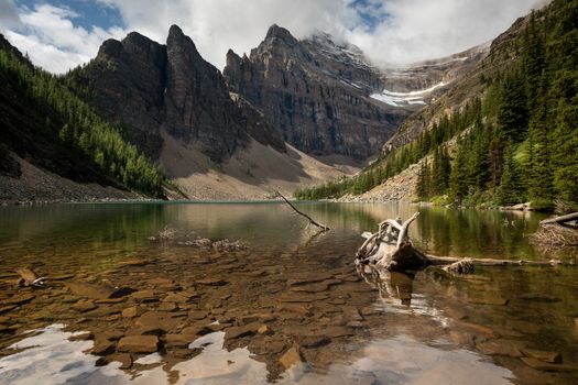 Panoramic image of Lake Agnes, a quiet place surrounded by the Rocky Mountains close to Lake Louise, Banff National Park, Alberta, Canada