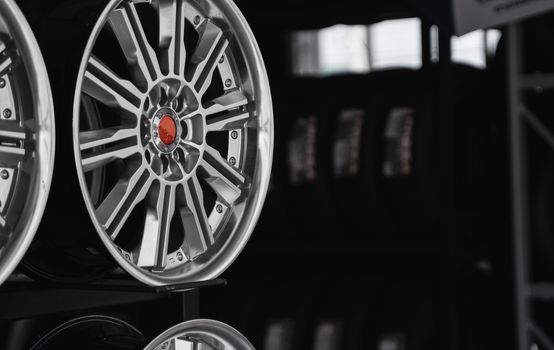 ar drives in the store with black background. Chrome car wheels for sale