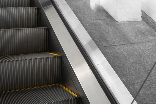 Ditry stairs on Escalator with yellow strips