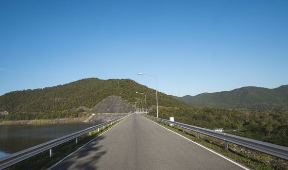 Safety steel barrier on freeway bridge designed to prevent the exit of the vehicle from the curb or bridge