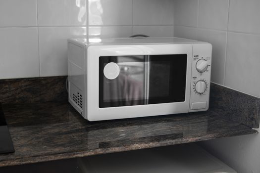 Microwave in a kitchen for cooking or heating a dish