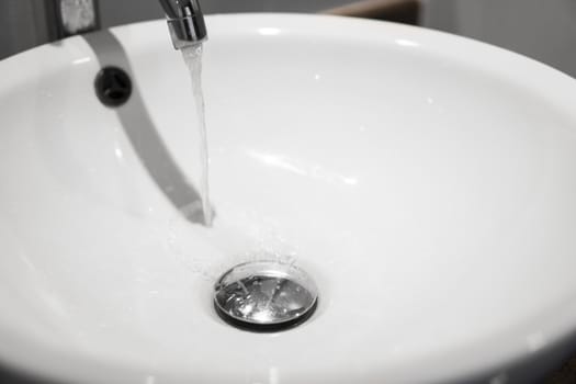 Round white sink in the bathroom