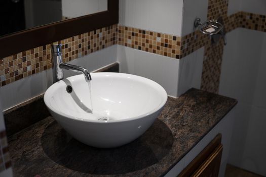 Round white sink in the bathroom