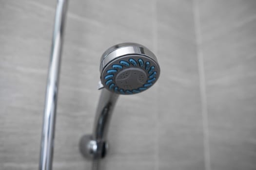 Modern shower head in modern bathroom. Shower head in bathroom with water spray or water flow. Feeling relax and enjoy in private bathroom. Fresh water flow from shower head for cleaning body dirty