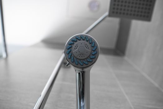 Square shower head and classic shower head in a modern bathroom. Shower in the bathroom with water spray or water. A stream of fresh water from the shower head to clean the dirty body