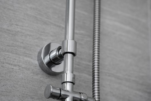 Chrome pipes and shower mounts in the modern bathroom