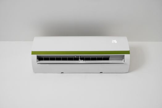 Air conditioner mounted on a white wall in the living room or bedroom. Indooor comfort temperature. Health concepts and energy savings