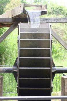 The wooden water wheel in a historic Mill 
