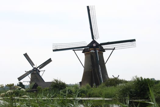 A beautiful, old, historic windmill, with four wings 