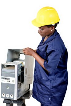 Young female computer maintenance worker checks the status of a computer CPU.