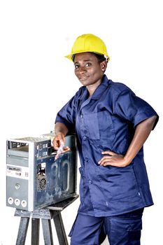 Young woman smiling in uniform standing, elbow on a desktop disassembled.