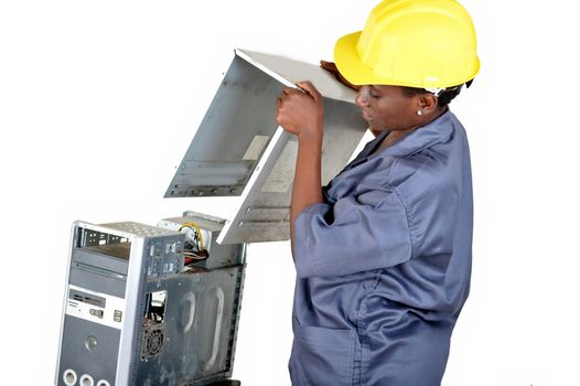 Young computer maintenance technician opens a desktop computer to locate the breakdown