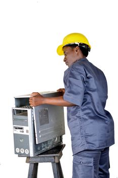 Young computer maintenance technician opens a desktop computer to locate the breakdown