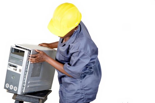 Young computer maintenance technician opens a desktop computer to locate the breakdown.